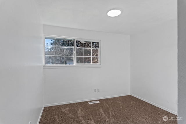 empty room featuring carpet floors