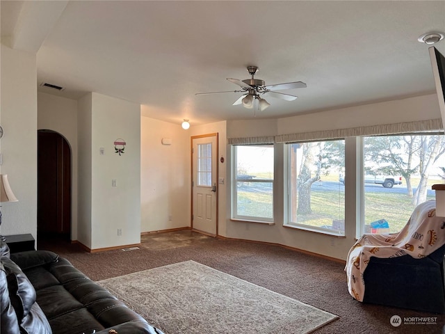 living room featuring ceiling fan and carpet flooring