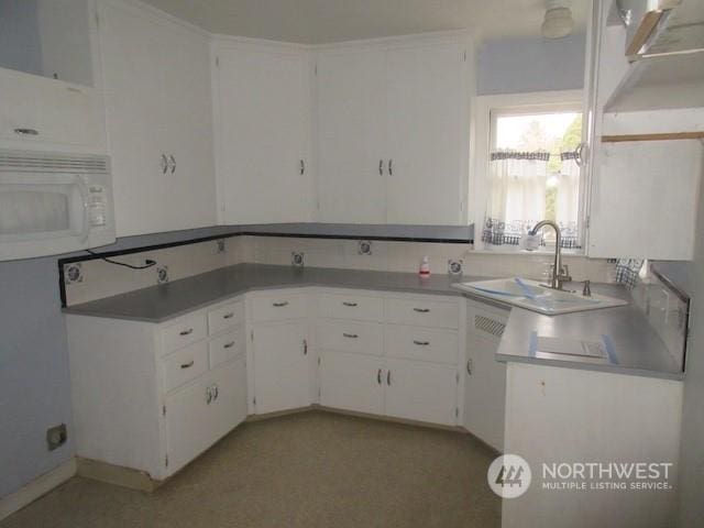 kitchen with sink and white cabinets