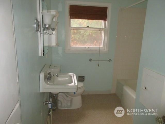 bathroom featuring sink and toilet