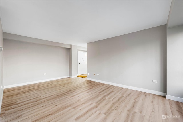 unfurnished room with light hardwood / wood-style floors