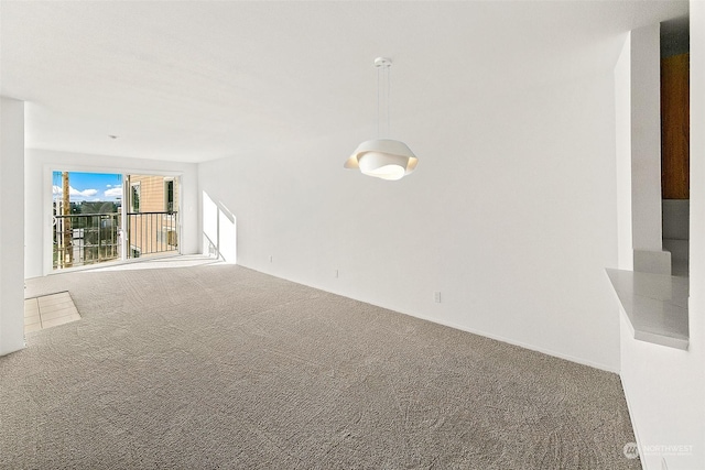 unfurnished living room with carpet floors