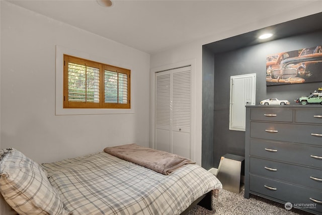 carpeted bedroom with a closet