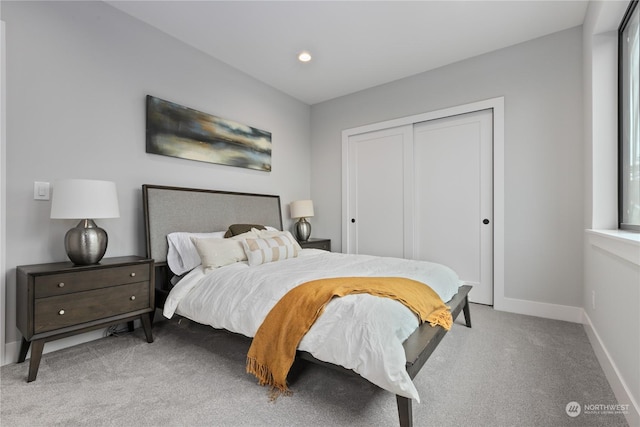 carpeted bedroom featuring a closet