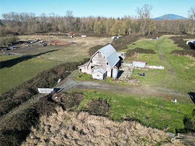 drone / aerial view with a mountain view and a rural view