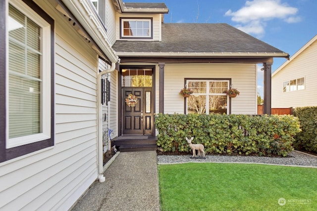 property entrance featuring a yard