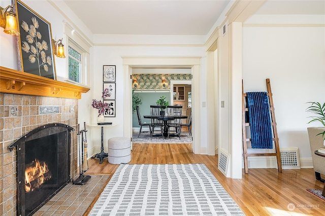 interior space with a fireplace and light hardwood / wood-style floors