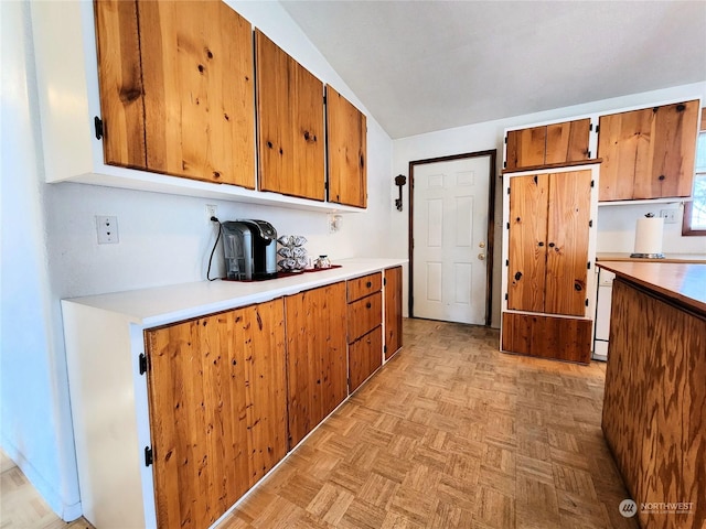 kitchen featuring dishwasher and light parquet flooring