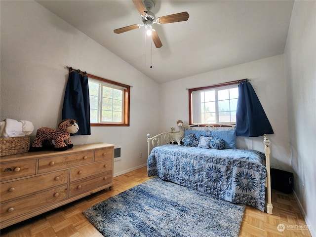 bedroom featuring heating unit, ceiling fan, vaulted ceiling, and light parquet flooring