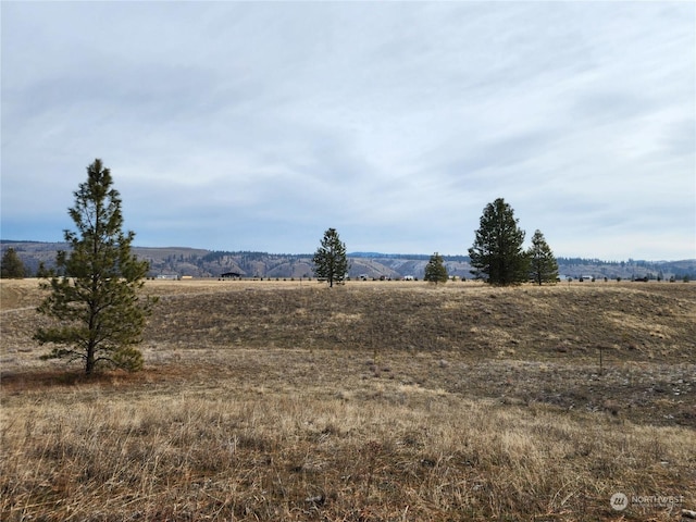 view of mountain feature with a rural view