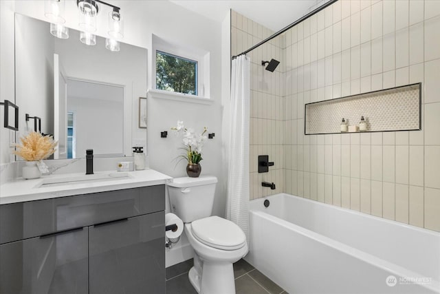 full bathroom with tile patterned flooring, shower / tub combo, vanity, and toilet