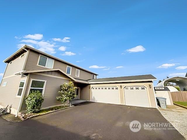 view of front of property featuring a garage