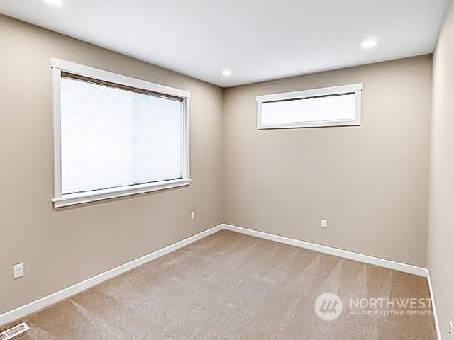 view of carpeted spare room