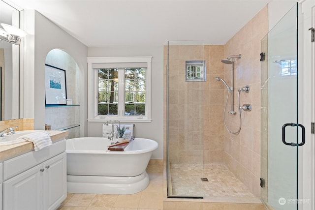 bathroom with vanity, tile patterned flooring, and independent shower and bath