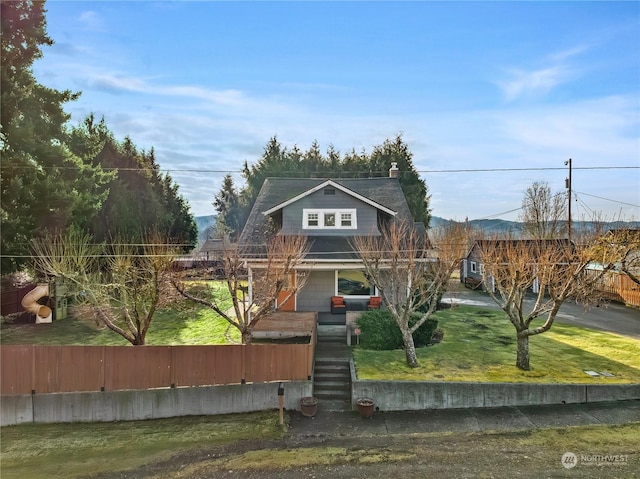 view of property featuring a front yard