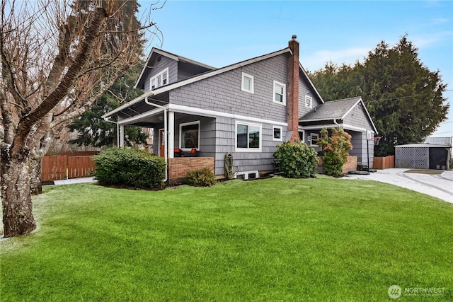 view of front of property featuring a garage and a front yard