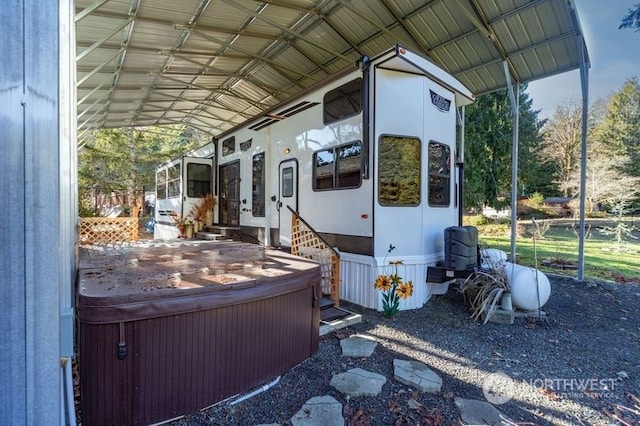 exterior space featuring a hot tub