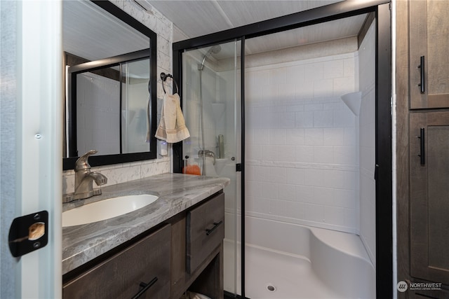 bathroom with vanity and walk in shower