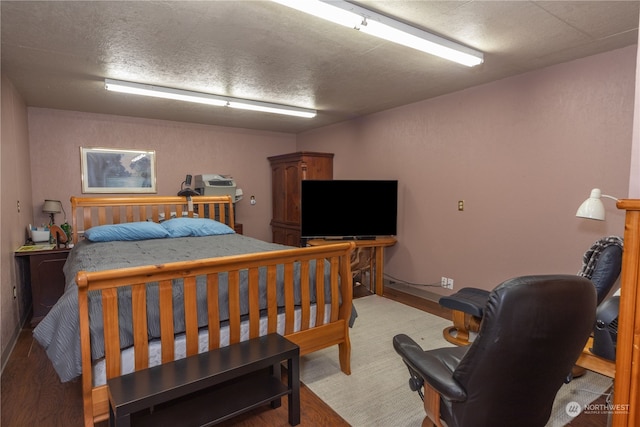 carpeted bedroom featuring a textured ceiling