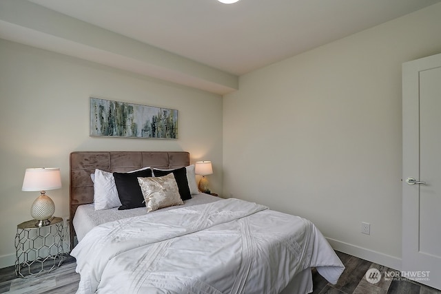 bedroom with hardwood / wood-style flooring