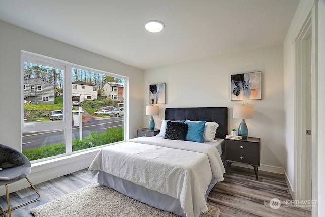 bedroom with hardwood / wood-style flooring