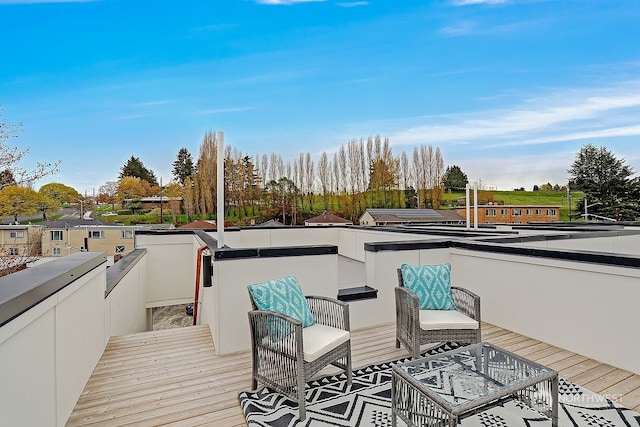 wooden terrace with outdoor lounge area