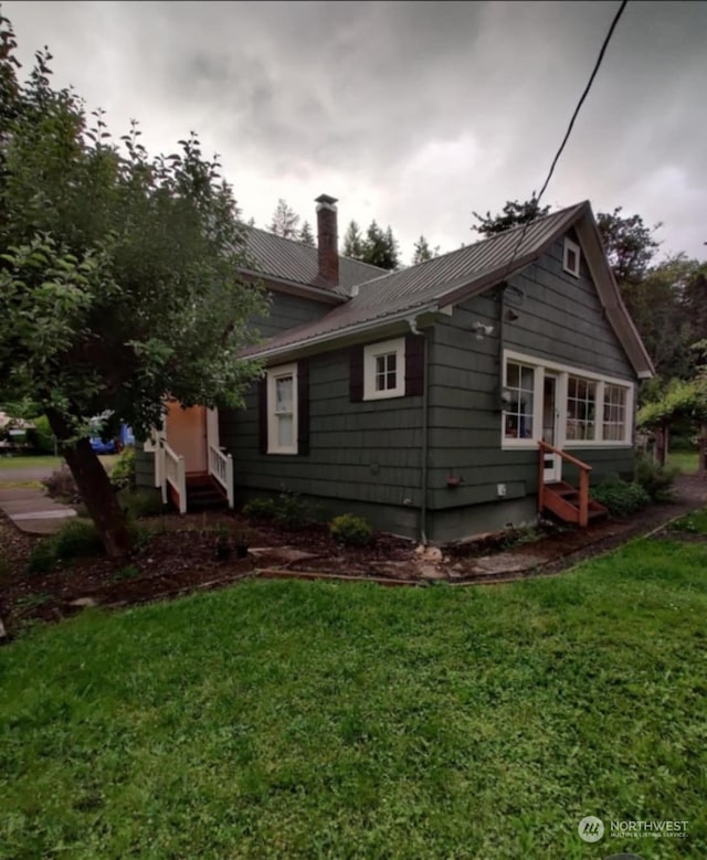 exterior space with a front yard