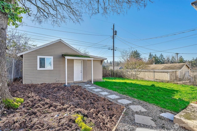 view of outbuilding with a lawn