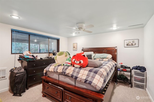 bedroom with ceiling fan and light carpet