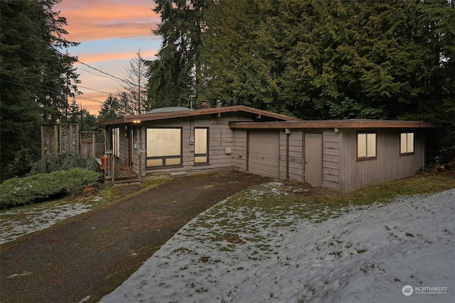 view of front facade with an outbuilding and a garage