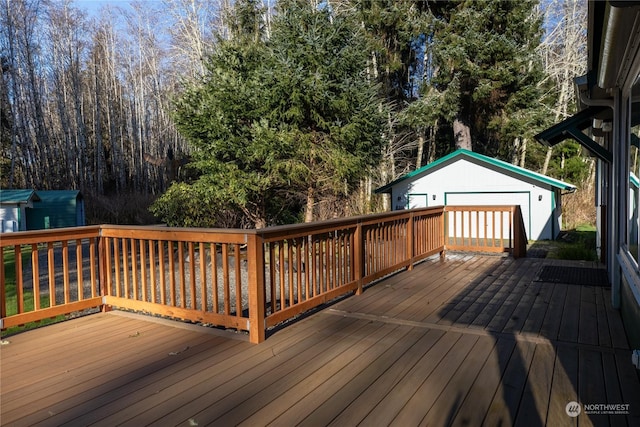 deck with an outbuilding and a garage