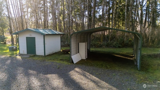 view of outbuilding with a carport