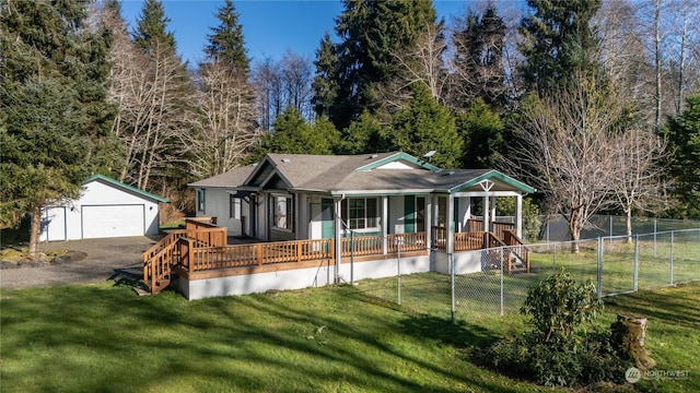 view of front of house with a porch, a garage, an outdoor structure, and a front lawn