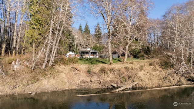 exterior space with a water view