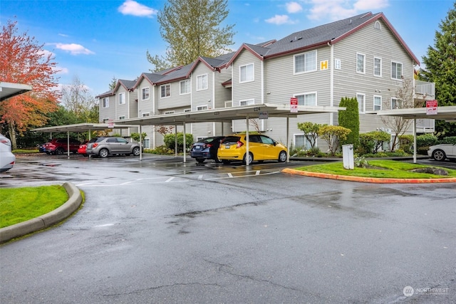 view of vehicle parking featuring a carport