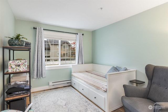 bedroom featuring a baseboard heating unit