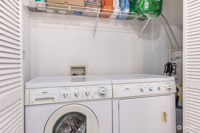 laundry area featuring washing machine and clothes dryer