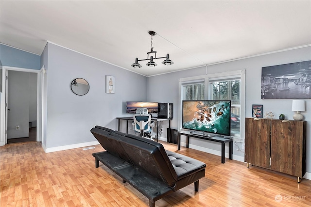 miscellaneous room featuring an inviting chandelier, vaulted ceiling, ornamental molding, and light wood-type flooring