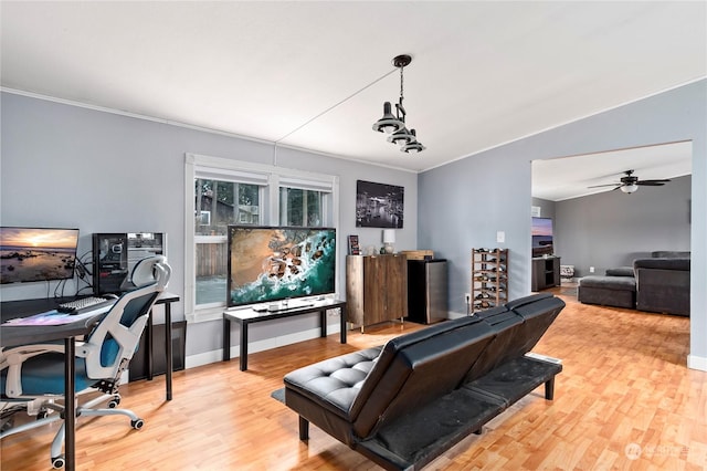 interior space with crown molding, wood-type flooring, and ceiling fan