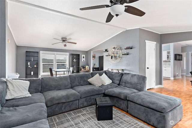 living room with crown molding, ceiling fan, lofted ceiling, and hardwood / wood-style floors