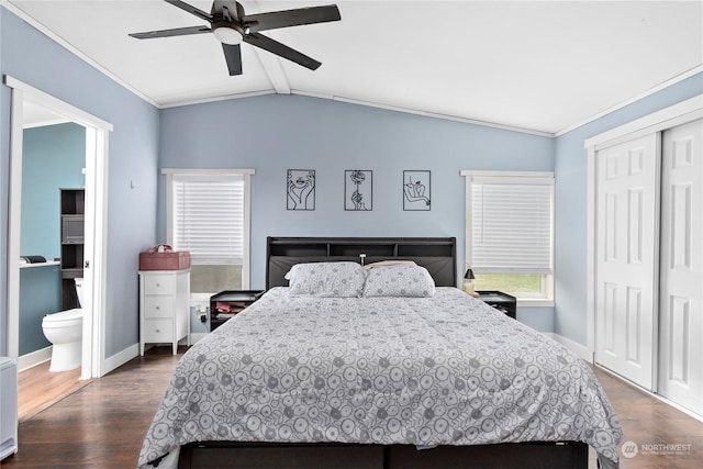 bedroom featuring lofted ceiling with beams, ornamental molding, dark hardwood / wood-style flooring, and a closet