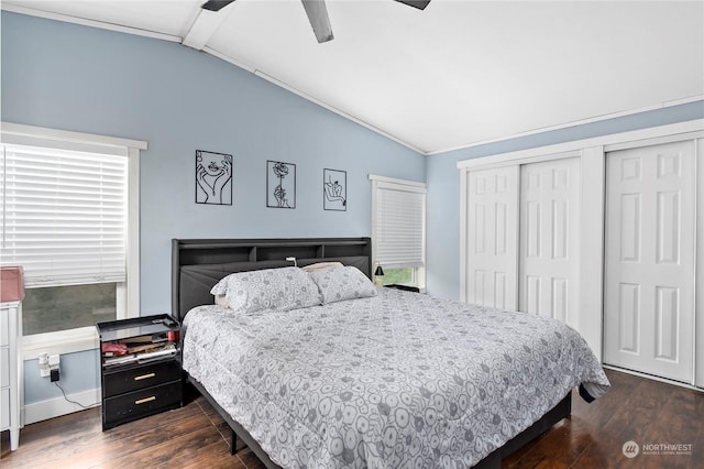 bedroom featuring ceiling fan, multiple windows, vaulted ceiling with beams, dark hardwood / wood-style flooring, and a closet