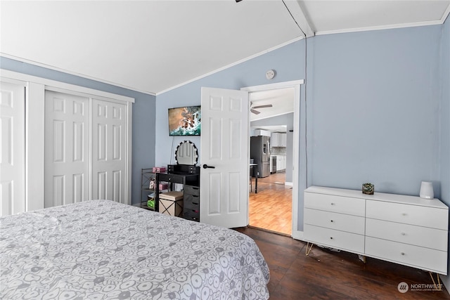 bedroom featuring dark hardwood / wood-style floors, vaulted ceiling with beams, ornamental molding, stainless steel refrigerator with ice dispenser, and a closet