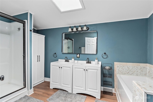 bathroom featuring vanity, separate shower and tub, wood-type flooring, and crown molding