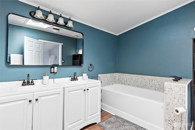 bathroom featuring vanity, a bathtub, wood-type flooring, and ornamental molding