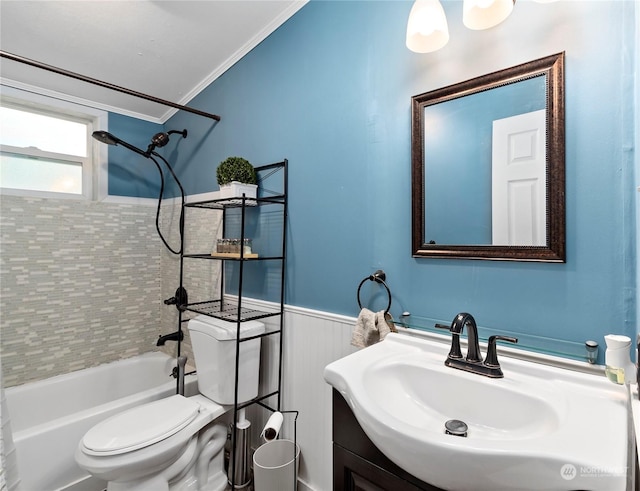 full bathroom with crown molding, tiled shower / bath, vanity, and toilet