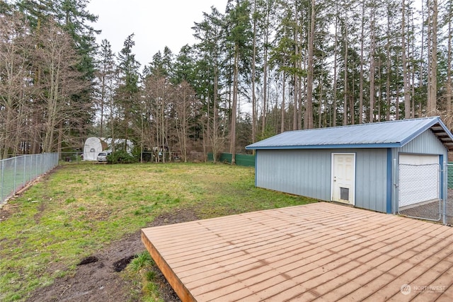 exterior space with a shed, a garage, and a yard