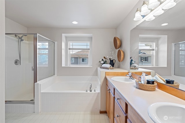 bathroom with vanity, tile patterned floors, and independent shower and bath