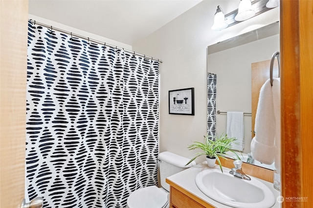 bathroom with vanity and toilet