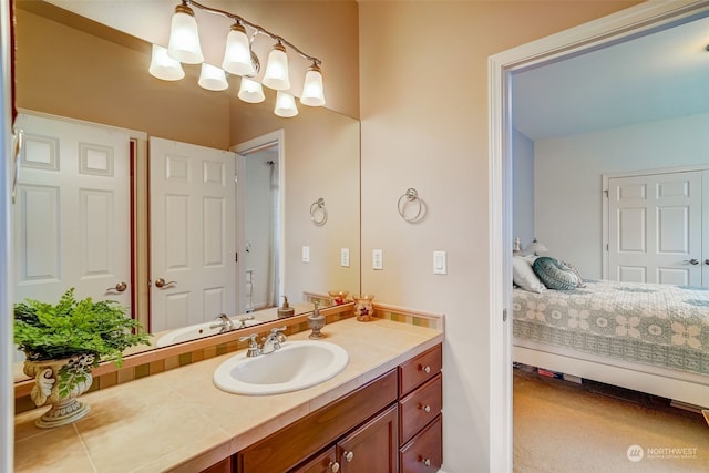 bathroom featuring ensuite bath and vanity